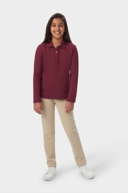 Girl wearing a French Toast burgundy long sleeve fitted interlock polo, front view showing feminine fit and picot trim collar. of  Long Sleeve Fitted Interlock Polo with Picot Collar (Feminine Fit)