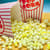 View thumbnail of Buttered Popcorn Jelly beans pouring out of a popcorn bucket onto table