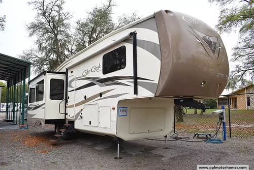 62477 - 36' 2015 Forest River Cedar Creek Hathaway 34RL w/3 Slides Image 1