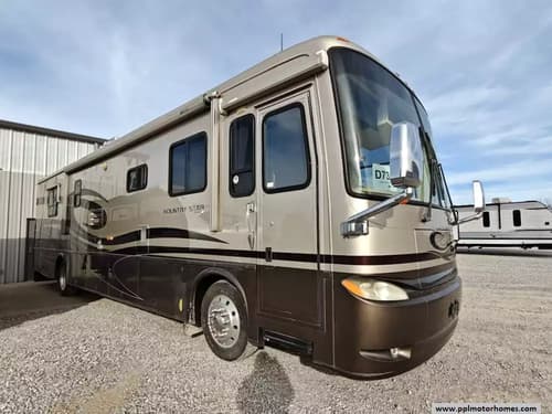 61675 - 39' 2005 Newmar Kountry Star 3908 330hp Cummins w/2 Slides Image 1