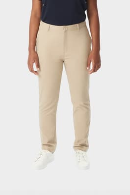 Young woman in khaki French Toast slim fit stretch twill pant, front view showing slim leg and waistband with belt loops. of  Girls' Slim Fit Stretch Twill Pant
