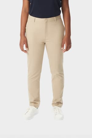 Young woman in khaki French Toast slim fit stretch twill pant, front view showing slim leg and waistband with belt loops. of  Girls' Slim Fit Stretch Twill Pant
