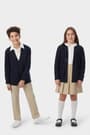 Boy and girl wearing navy French Toast v-neck cardigan sweaters, front view showing button up closure, long sleeves, co-ed fit. of  V-Neck Sweater Cardigan opens large image - 3 of 4