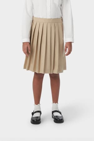 Front view of girl wearing khaki French Toast at the knee pleated skirt, showing knee length and all around knife pleats.
