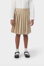 Front view of girl wearing khaki French Toast at the knee pleated skirt, showing knee length and all around knife pleats.