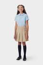 Front view of girl in khaki French Toast pleated two-tab skort, showing front knit pleats and classic tab detail styling.