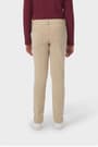 Girl wearing khaki French Toast slim fit stretch Ponte pant, back view showcasing back patch pockets and waistband. of  Girls' Slim Fit Stretch Ponte Pant opens large image - 4 of 4