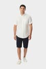 Man wearing a white French Toast short sleeve oxford shirt, front view showcasing classic fit and versatile style.