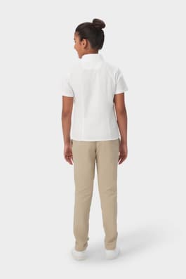 Back shot of girl wearing white French Toast girls&#39; short sleeve fitted oxford shirt, back detail, seams, and length. of  Short Sleeve Fitted Oxford Shirt (Feminine Fit)