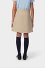 Girl in khaki French Toast pleated two-tab skort, back view showing above the knee length and hidden built-in knit short.
