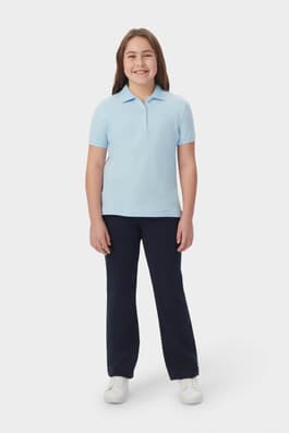 Girl wearing blue French Toast short sleeve fitted stretch pique polo front view showing feminine fit and collar. of  Short Sleeve Fitted Stretch Pique Polo (Feminine Fit)