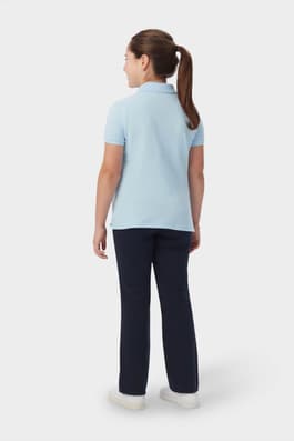 Back view of girl wearing blue  French Toast short sleeve fitted stretch pique polo, highlighting feminine fit. of  Short Sleeve Fitted Stretch Pique Polo (Feminine Fit)