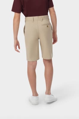 Boy wearing khaki French Toast flat front stretch twill short, back shot showcasing waistband with belt loops and back pocket. of  Boys' Flat Front Stretch Twill Short