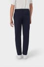 Back view of boy in navy French Toast slim fit taper leg stretch performance pant, showing slim fit and classic styling. of  Boys' Slim Fit Taper Leg Stretch Performance Pant opens large image - 4 of 4