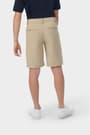 Boy wearing khaki French Toast flat front stretch performance short, back view showing waistband and pockets. of  Boys' Flat Front Stretch Performance Short opens large image - 4 of 5