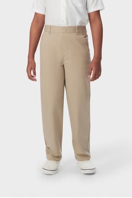 Boy wearing khaki French Toast boys&#39; pull-on relaxed fit stretch twill pant, showing side pockets and waistband, front view. of  Boys' Pull-On Relaxed Fit Stretch Twill Pant