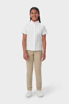 Front shot of girl wearing white French Toast girls&#39; short sleeve fitted oxford shirt, showing front button up closure. of  Short Sleeve Fitted Oxford Shirt (Feminine Fit)