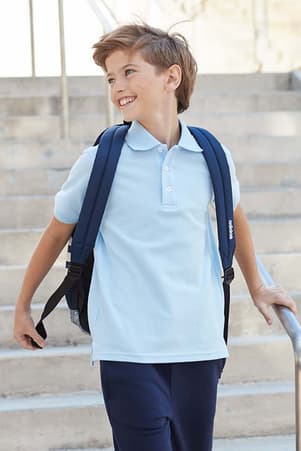 Girl in blue short sleeve polo shirt and headphones. of  Short Sleeve Piqué Polo