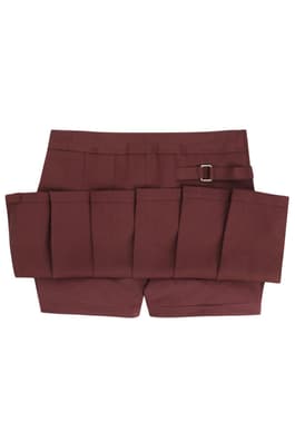 Front view of girl in khaki French Toast pleated two-tab skort, showing front knit pleats and classic tab detail styling.