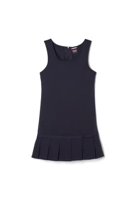 Front view of pleated twill jumper with ribbon bow