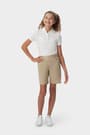 Front view of girl wearing khaki French Toast girls&#39; pull-on twill short, showing mock button fly and midi length. of  Girls' Pull-On Twill Short opens large image - 3 of 4