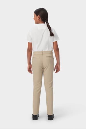 Girl in khaki French Toast girls&#39; slim fit stretch twill pant, front view showing slim leg and on seam pockets.  of  Girls' Slim Fit Stretch Twill Pant