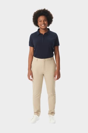 Young woman in khaki French Toast slim fit stretch twill pant, front view showing slim leg and waistband with belt loops. of  Girls' Slim Fit Stretch Twill Pant