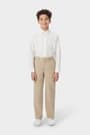 Boy wearing khaki French Toast boys&#39; relaxed fit twill pant, front view showing relaxed fit and waistband with belt loops. of  Boys' Relaxed Fit Twill Pant opens large image - 3 of 5