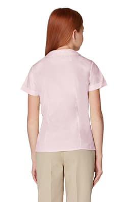 Back view of girl wearing white French Toast short sleeve Peter Pan collar blouse, showing back princess seams.