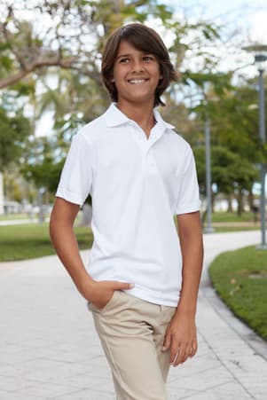Boy in white performance polo shirt of  Short Sleeve Performance Polo