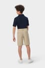 Boy wearing khaki French Toast flat front stretch performance short, back view showing waistband and pockets. of  Boys' Flat Front Stretch Performance Short opens large image - 4 of 5