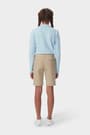 Girl wearing khaki French Toast twill Bermuda short, back shot showcasing welted back pockets and waistband with belt loops. of  Girls' Stretch Twill Bermuda Short opens large image - 4 of 5