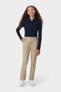 Front view of girl wearing khaki girls&#39; pull-on straight fit stretch twill pant, showing waistband and side pockets. of  Girls' Pull-On Straight Fit Stretch Twill Pant opens large image - 3 of 4