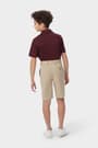 Boy wearing khaki French Toast flat front stretch twill short, back shot showcasing waistband with belt loops and back pocket. of  Boys' Flat Front Stretch Twill Short opens large image - 4 of 5