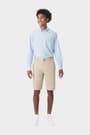 Young man wearing khaki French Toast flat front stretch twill short, front shot showing above the knee length and waistband. of  Boys' Flat Front Stretch Twill Short opens large image - 5 of 5