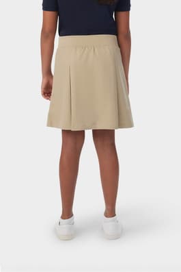 Back view of girl in khaki French Toast pull-on kick pleat performance skort, showing moisture wicking fabric.