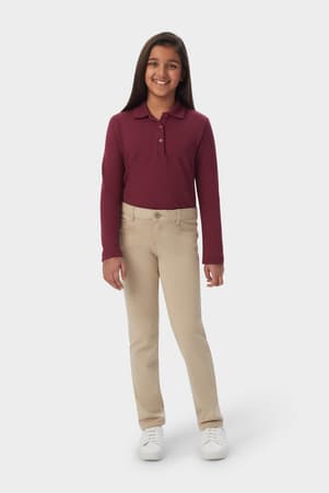 Girl wearing khaki French Toast girls&#39; slim fit stretch Ponte pant, front view showing belt loops and slim leg. of  Girls' Slim Fit Stretch Ponte Pant