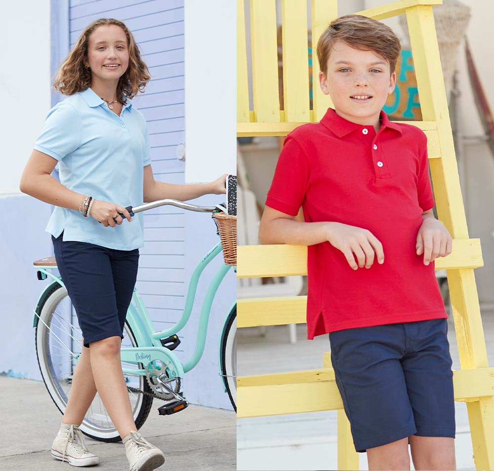 girl and boy wearing short sleeve polos and navy shorts