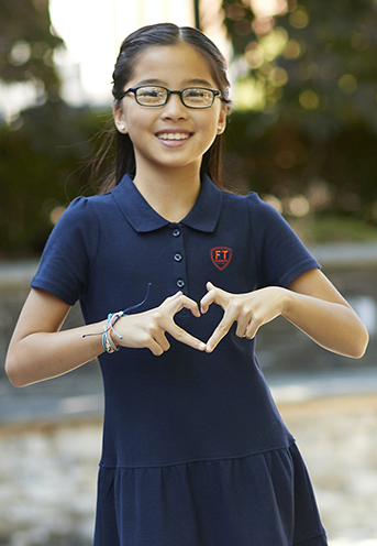 girl wearing navy pique polo dress