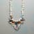 CHARMED PEARL NECKLACE view 1