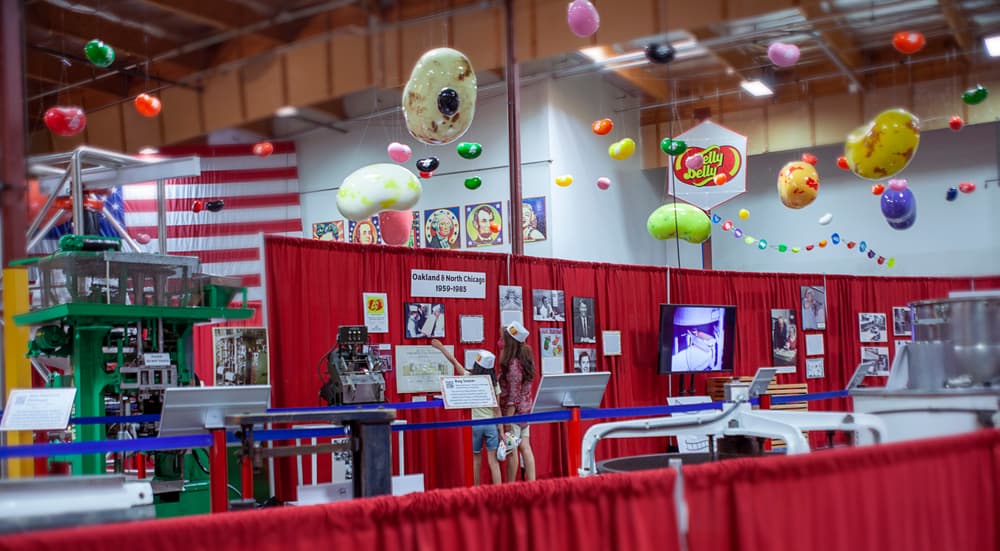 display of old candy making machines and various picture frames of jelly belly history