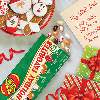 Holiday Favorites Gift Box on a table with Christmas cookies and a Christmas wish list