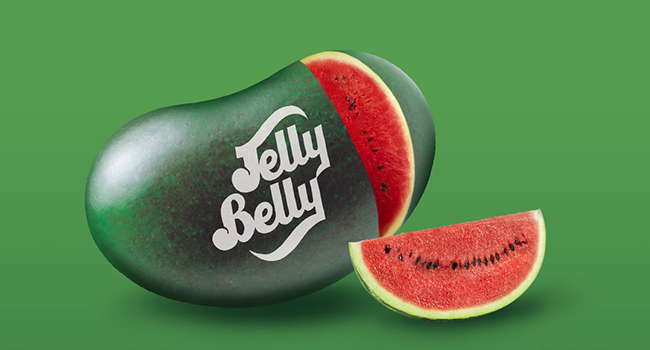 Watermelon jelly bean with a slice of watermelon cut out of it