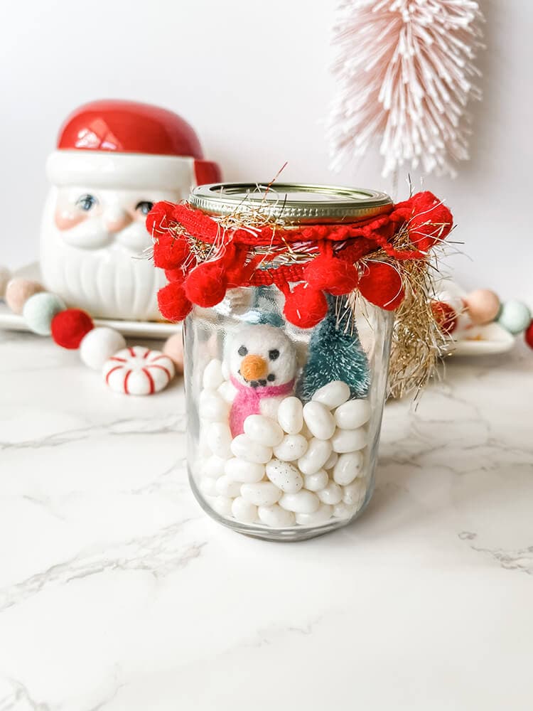 white jelly beans in a decorated jar