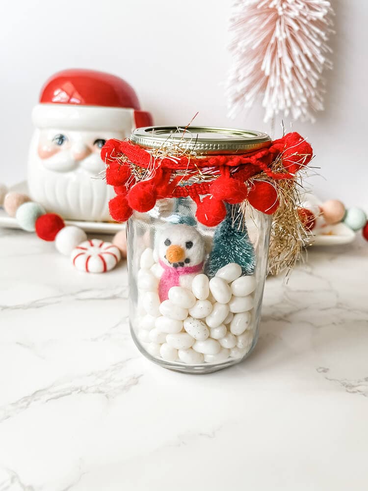 white jelly beans in a decorated jar